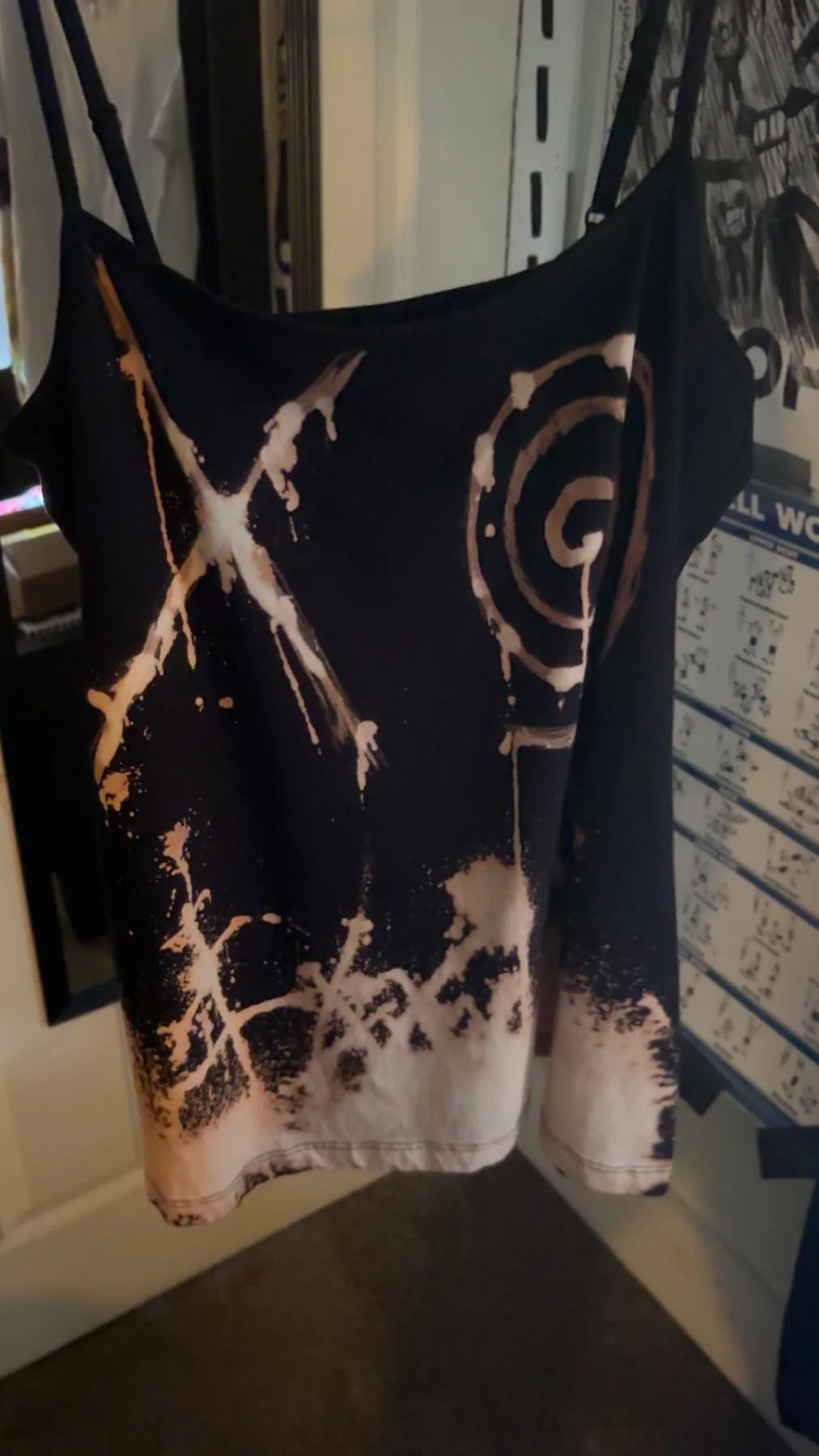 Black handmade tank top with bleach splashes, an X, and spiral